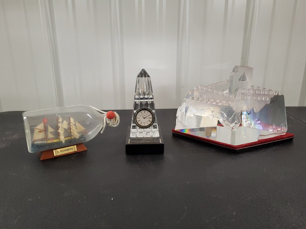 Cut glass castle sculpture, ship in a bottle