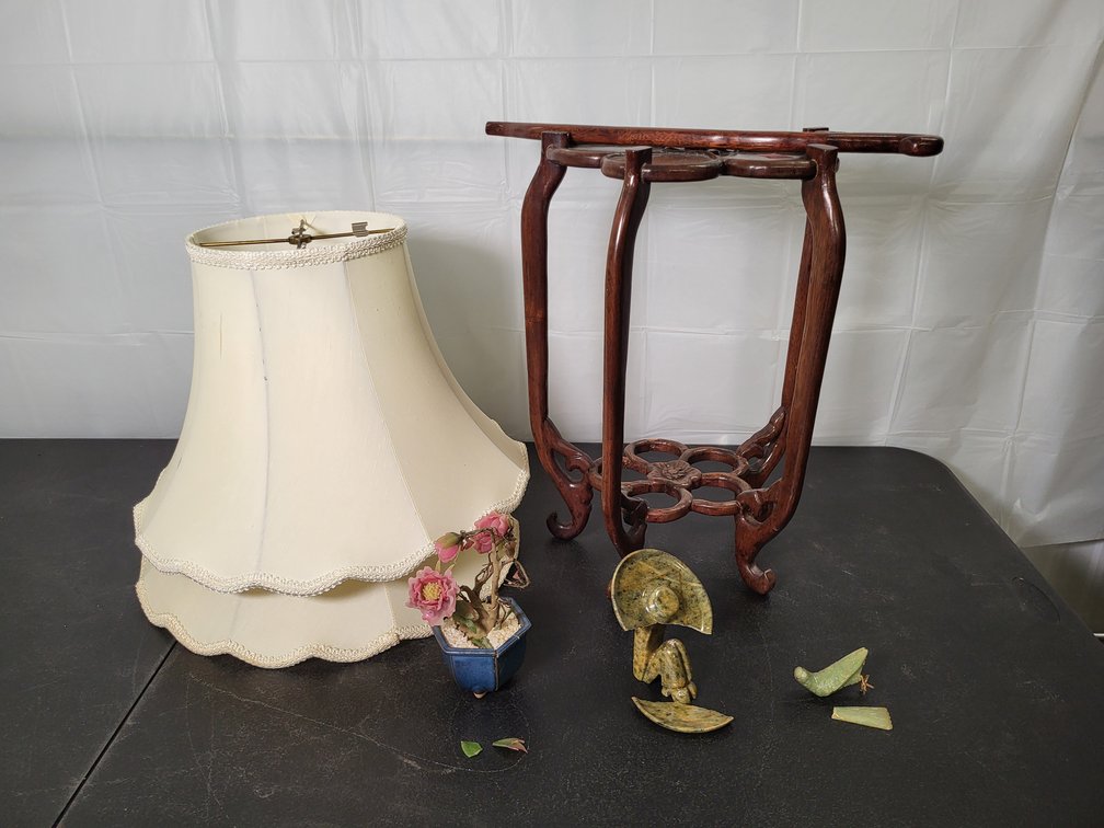Damaged items: (2) Lampshade, flower table, resin/glass flower, bird, stone sombrero