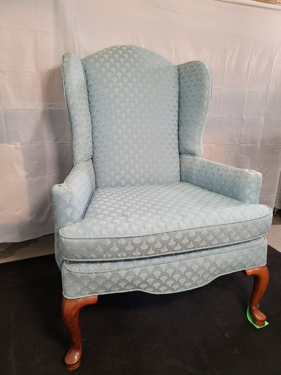 Blue upholstered wingback chair 