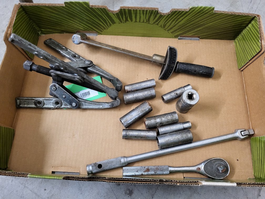 1/2" drive deep well sockets, breaker bar, gear puller