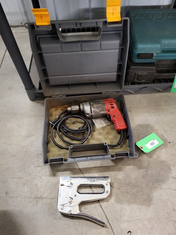 Milwaukee 3/8" drive drill, Arrow staple gun, and case