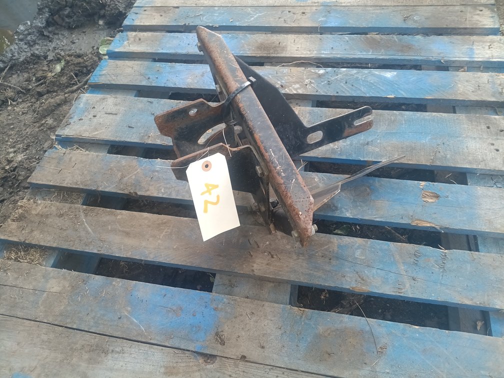 Bagger bracket for a garden tractor 