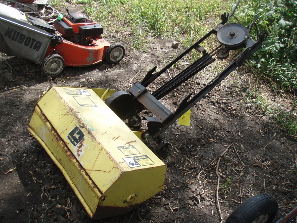 John Deere rototiller off of 320 lawn tractor