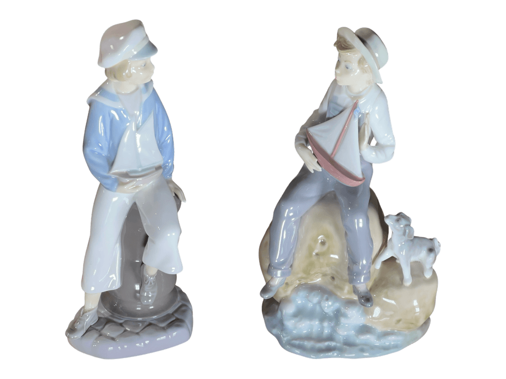 Pair of Lladró glazed porcelain nautical boy figurines, Daisa marks, 9" H