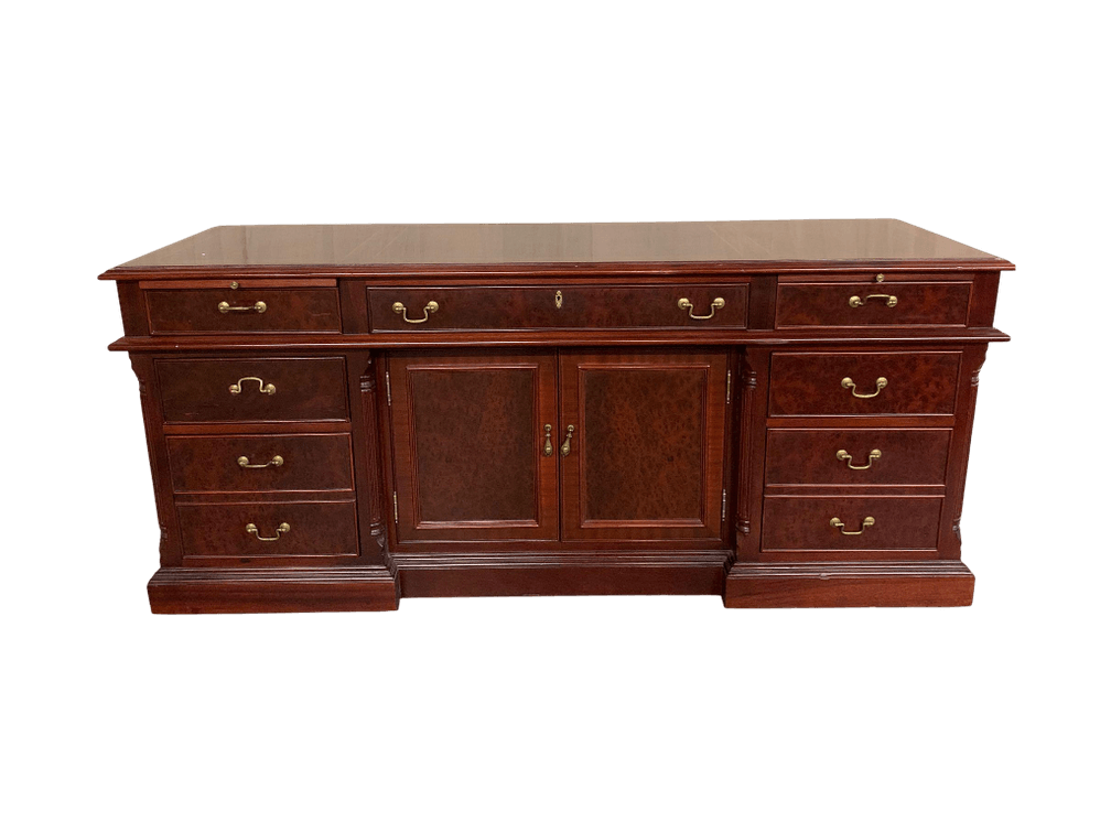 $4,500+ Mahogany-veneered pedestal sideboard/partners’ desk with inset leather writing surface and brass swan-neck pulls