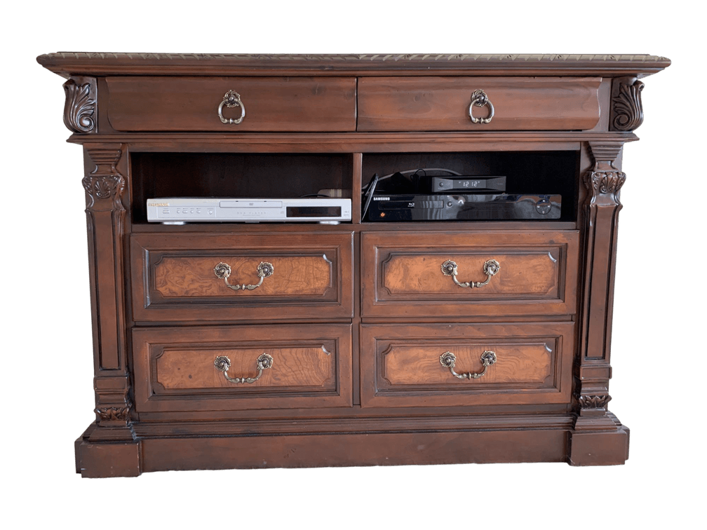 Wooden Media Cabinet with Decorative Carved Details and Brass Handles