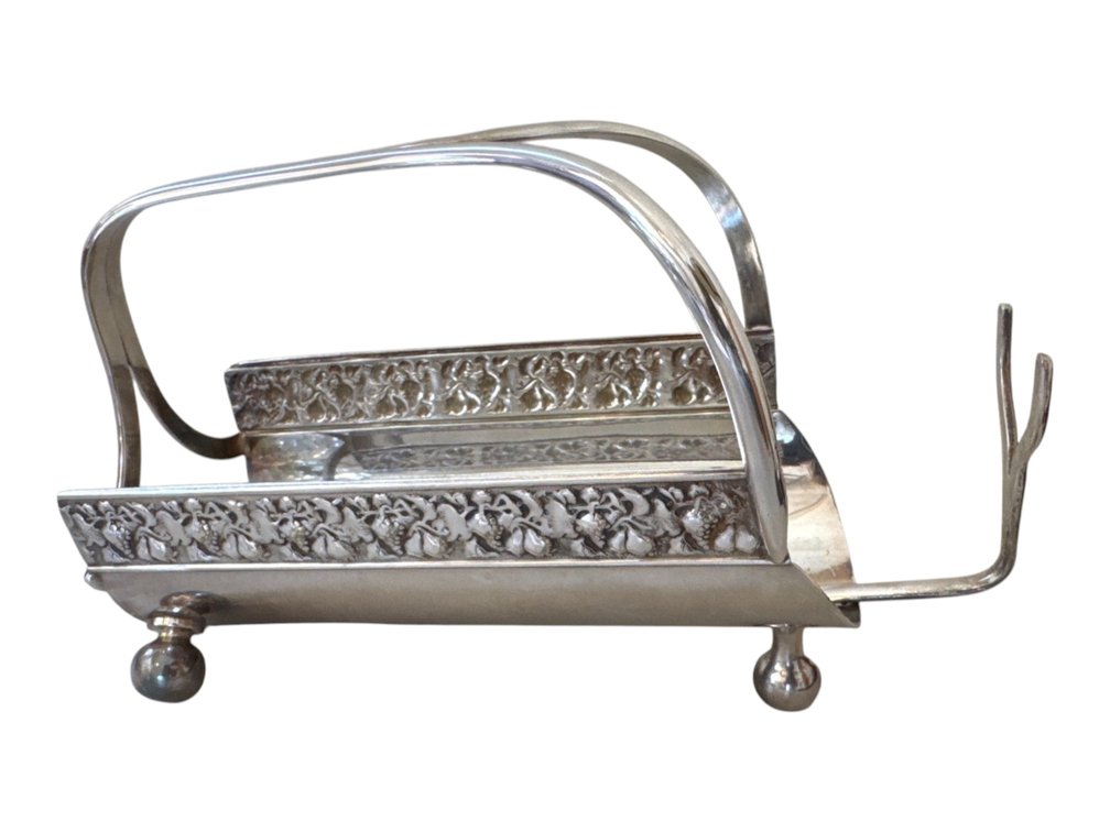 Silverplate toast rack with pierced floral borders, 7 in.