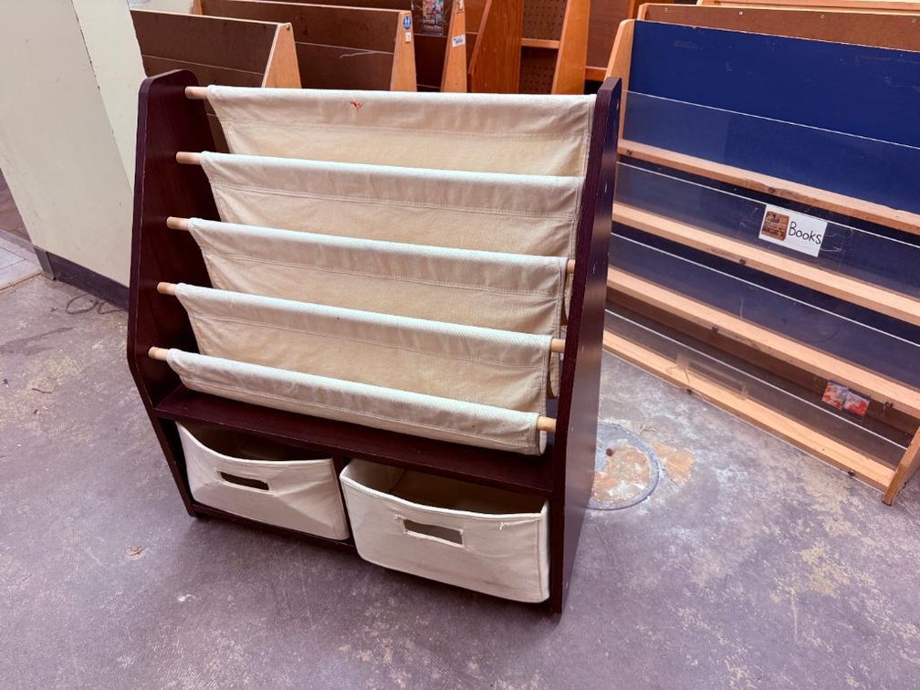 Wood and Fabric Front Facing Bookshelf w/ Lower Cloth Basket Storage