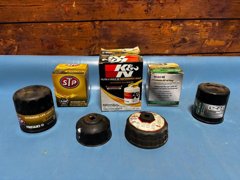 Group of Automotive Oil Filters, K&N, STP, Mobil 1, Filter Sockets