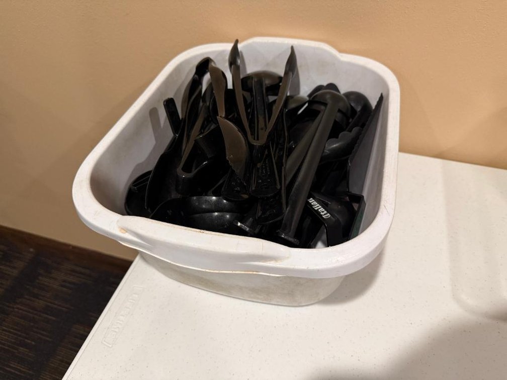 Tub of Salad Bar Serving Utensils