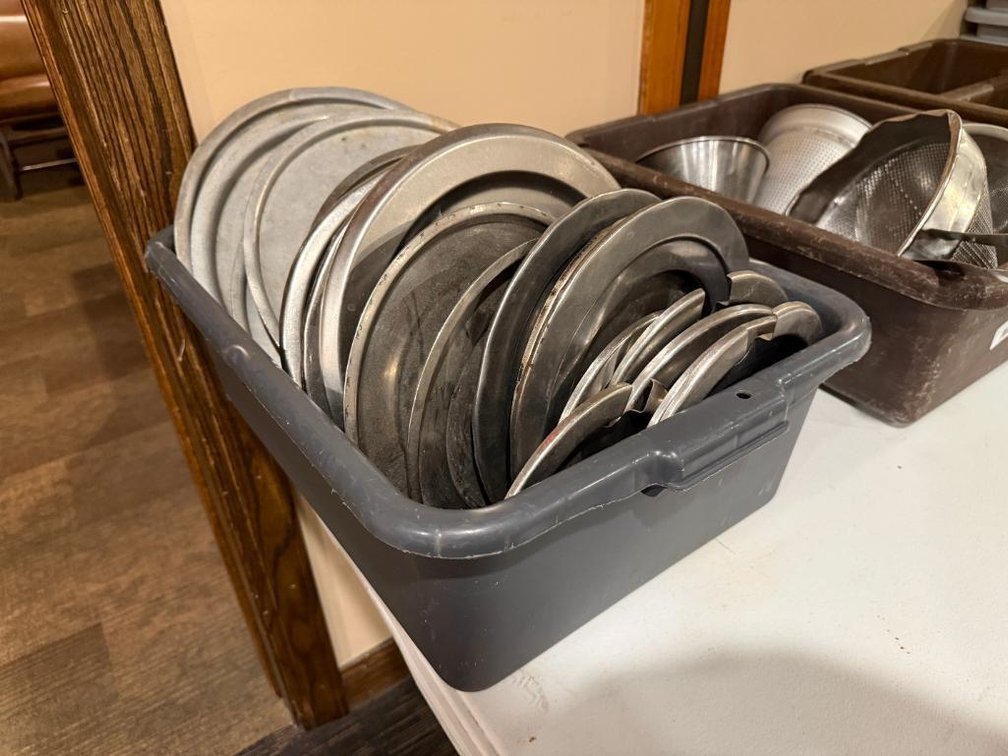 Bus Tub Full of Stock Pot and Soup Kettle Lids