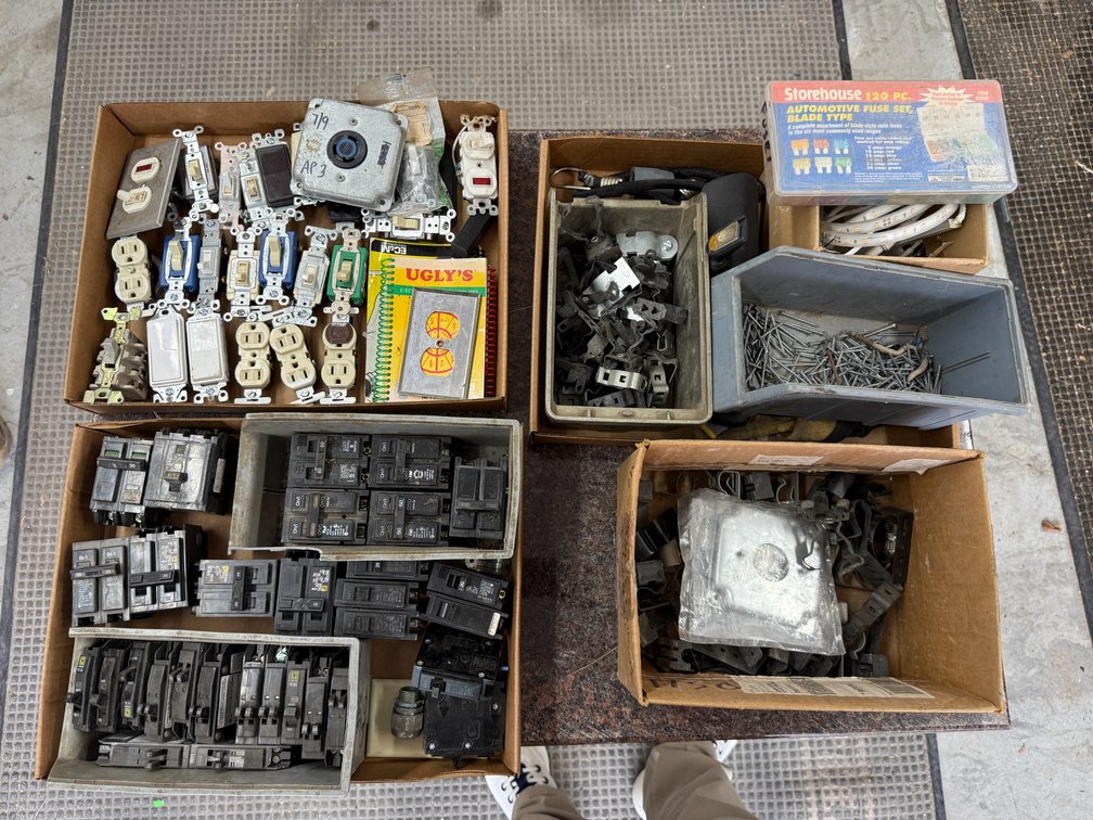 Four Boxes of Electrical Supply & Hardware; Circuit Breakers, Electrical Outlets & Switches, LED Strips, Clips, Fuses, Books