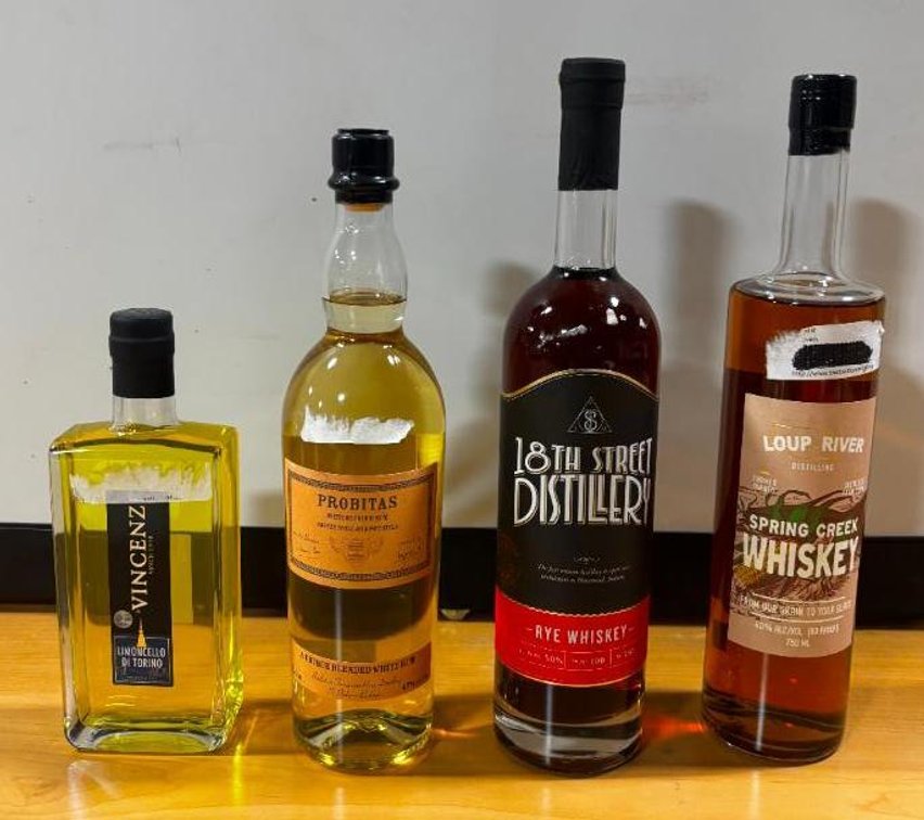 4 Sealed Bottles (3) 750ml Loup River Whiskey, 18th St Rye Whiskey, Probitas White Rum (1) 375ml Limoncello Di Torino