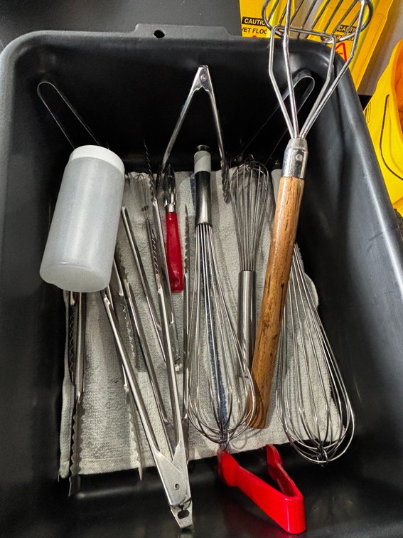 Bus Tub Full of Utensils and Supplies; Whisks, Tongs, Masher, Misc. See Images