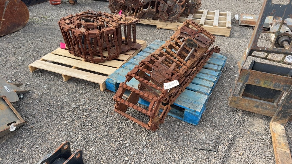 SET OF STEEL SKID STEER TRACKS