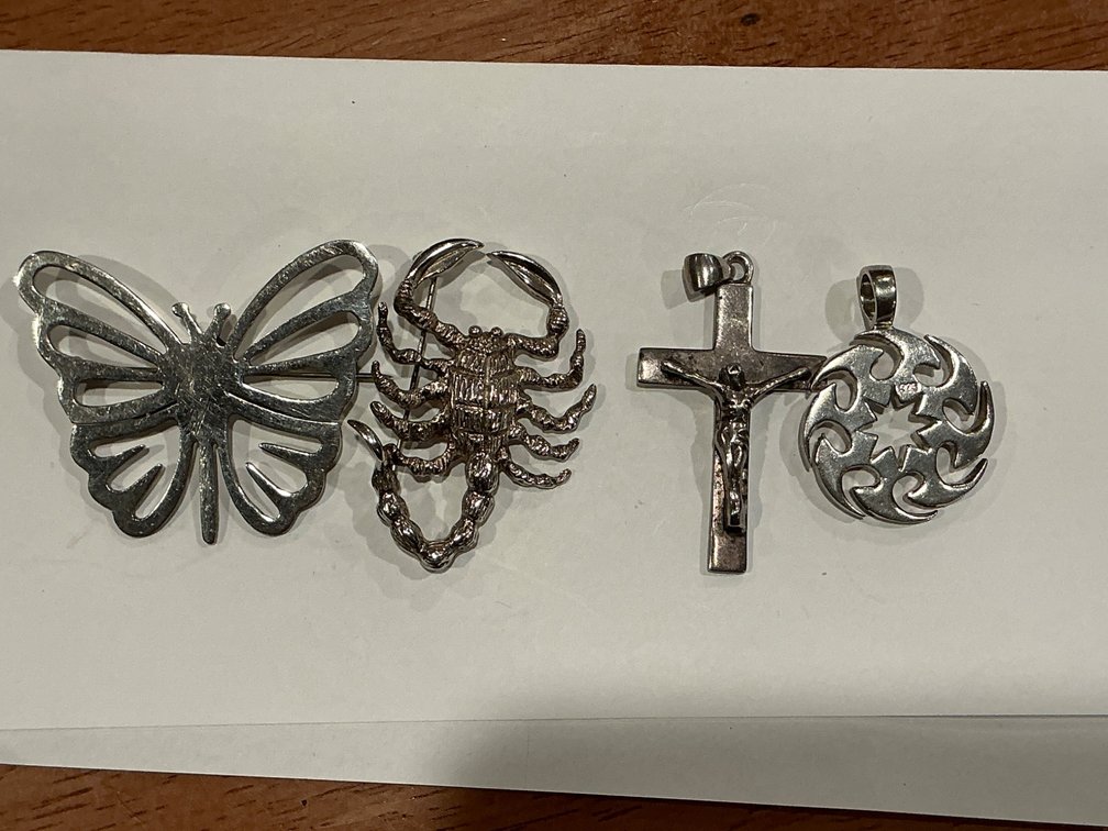 Collection of 925 Sterling Silver Butterfly, Scorpion, Cross, and Round Pendants, 60.665 Grams