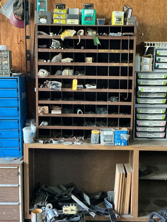 Brown Cabinet With Individual Compartments and Contents Including Hardware