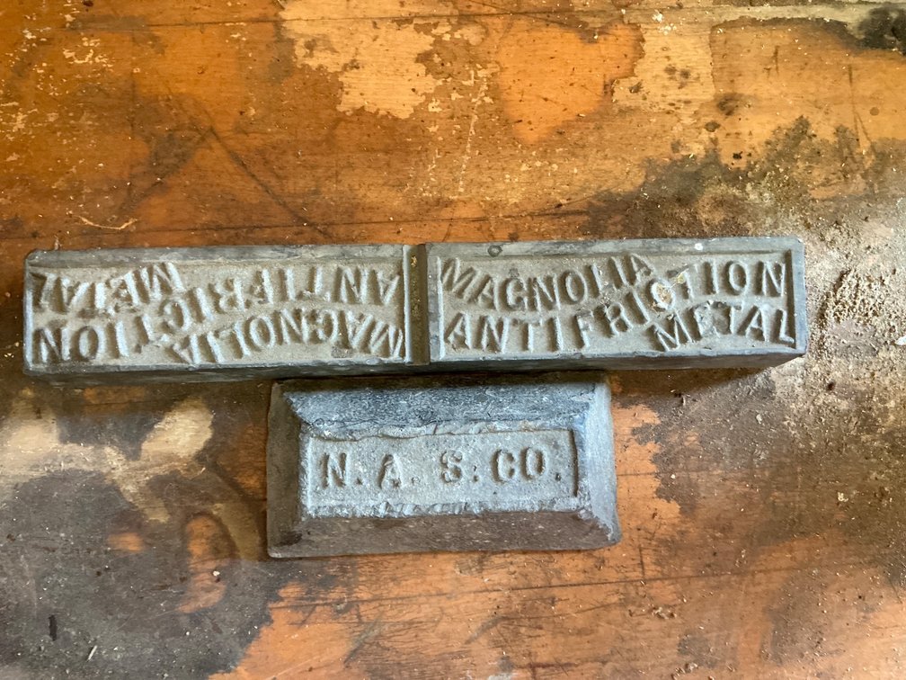 Collection of Three Metal Ingots Embossed with Manufacturer Marks