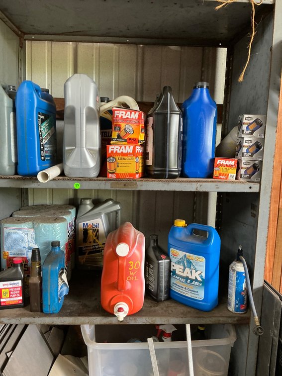 Assorted Motor Oils, Filters, and Maintenance Supplies in a Multi-Piece Lot