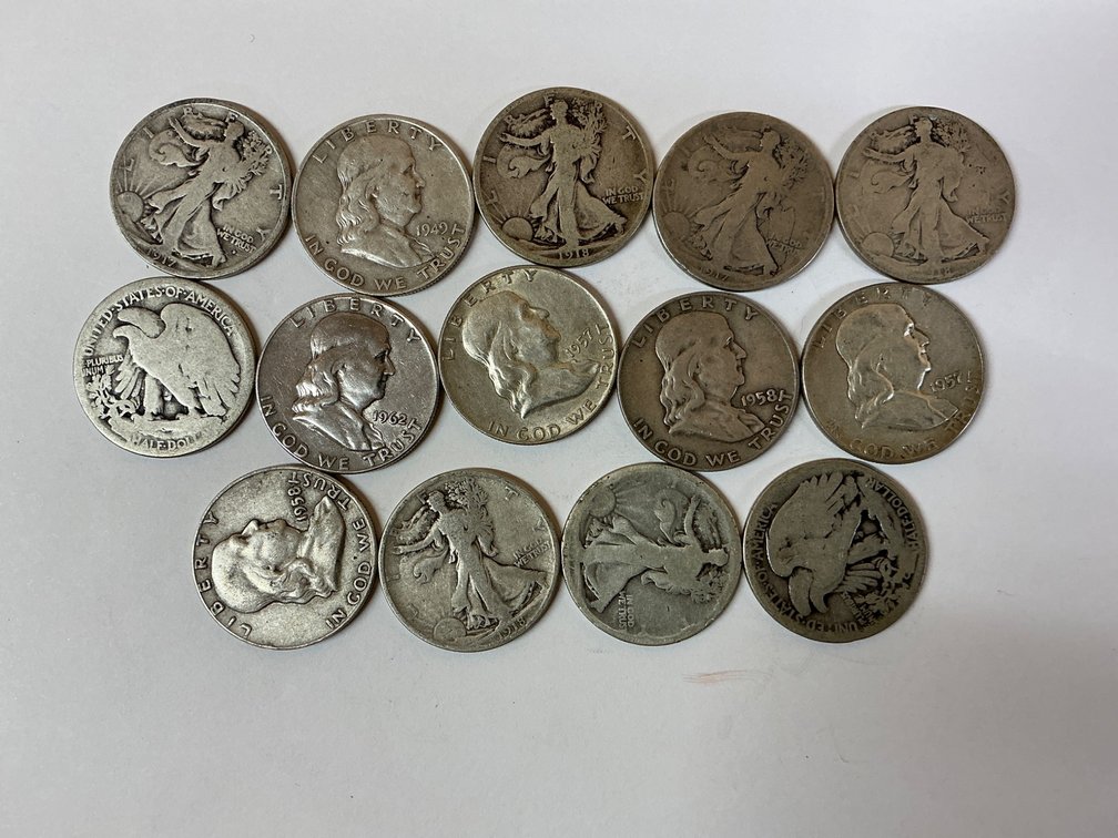 Fourteen Silver Half Dollars Featuring Diverse Designs