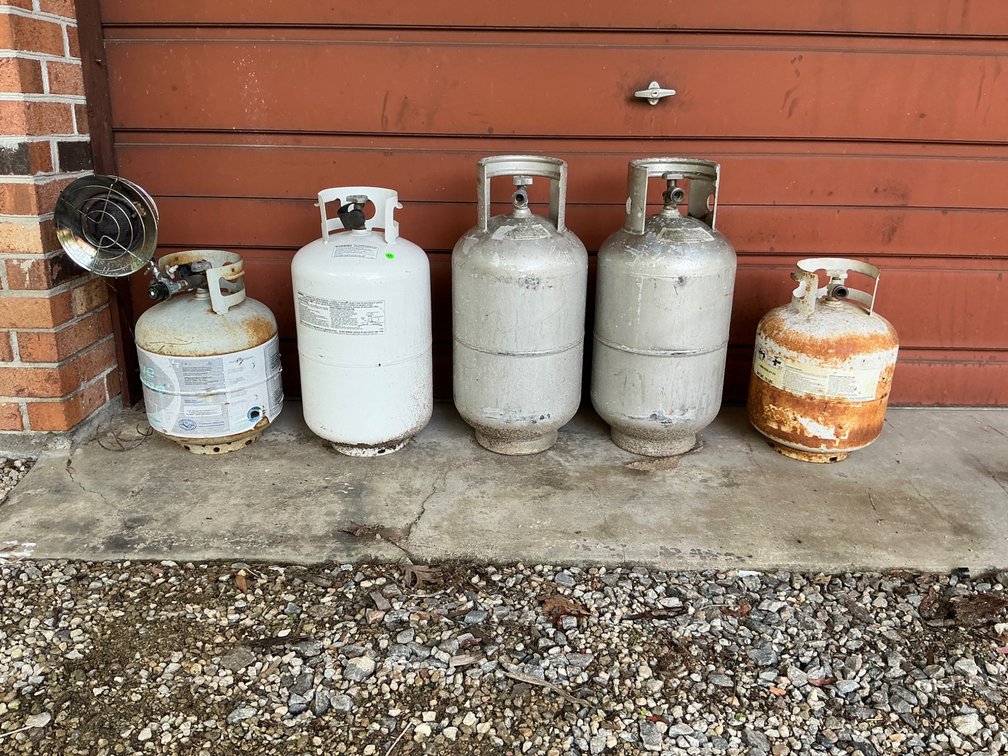 Five Mostly Empty Propane Tanks