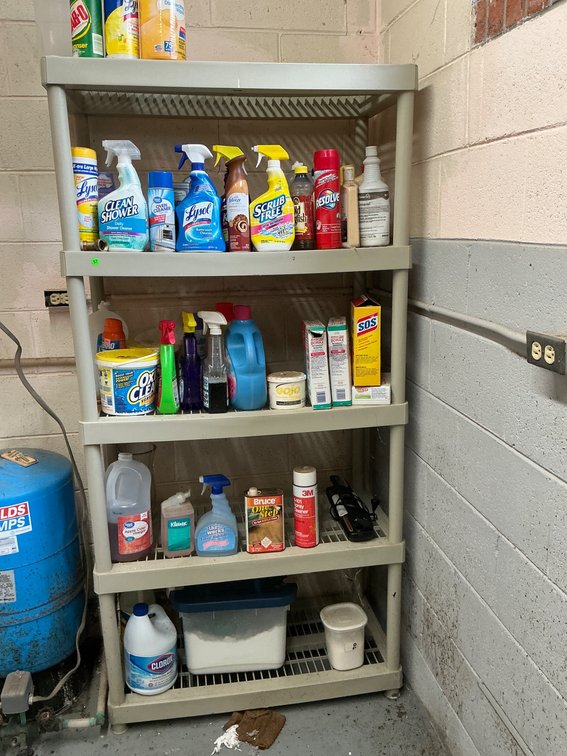 Plastic Storage Shelf with Assorted Cleaning Supplies, Mostly Full