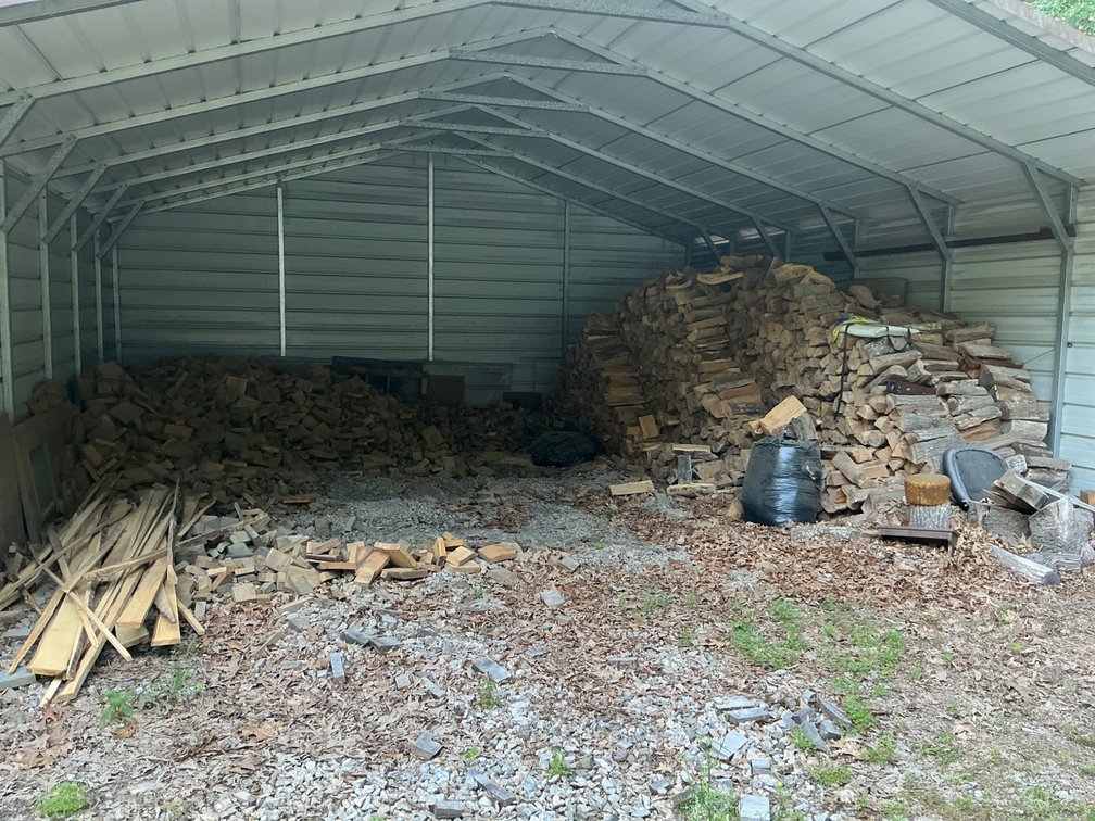 Firewood, Sawdust, and Miscellaneous Items From Carport
