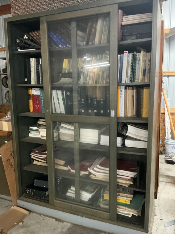 Extensive Collection of Automotive Manuals (Cabinet Not Included)