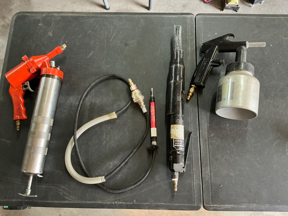 Pneumatic Tools Including Needle Scaler, Die Grinder, Sandblaster, and Grease Gun.