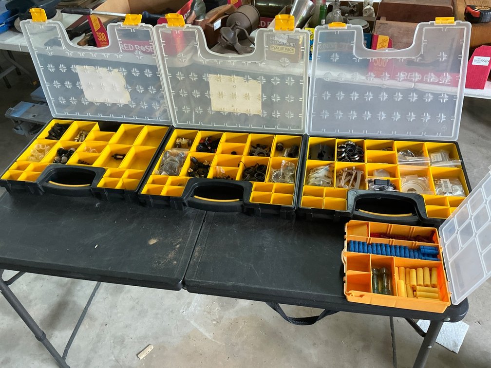 Comprehensive Assortment of Small Engine Repair Parts in Organized Cases
