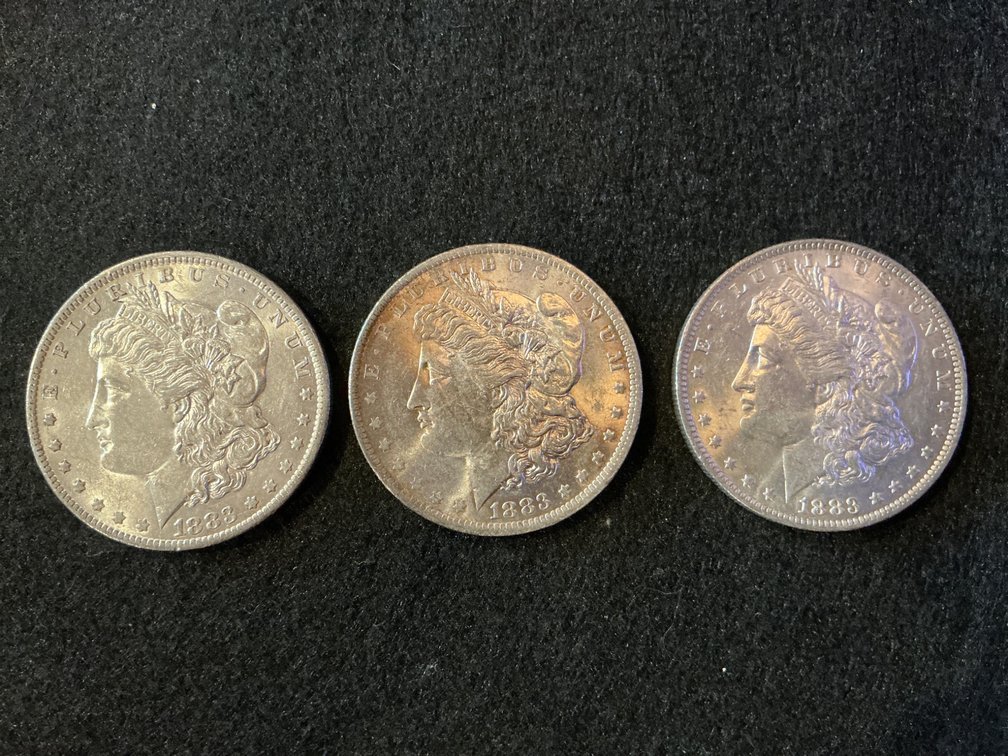 Three 1883 Morgan Silver Dollars with O Mint Mark