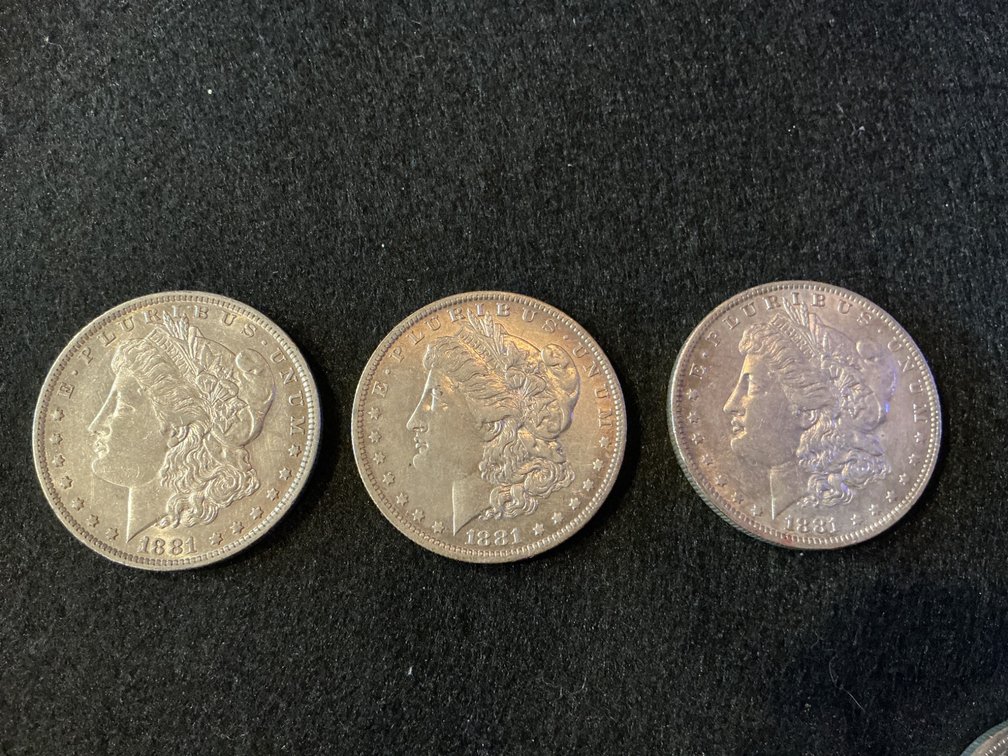 Three 1881 Morgan Silver Dollars with New Orleans Mint Mark