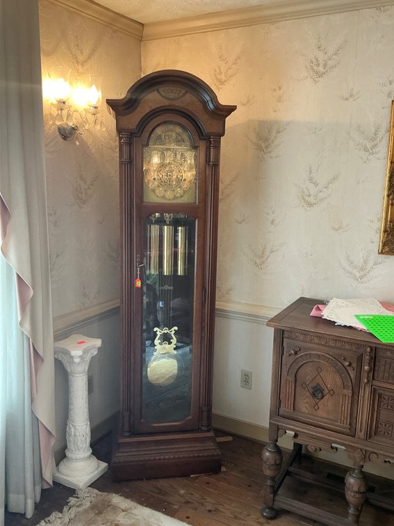 Howard Miller Grandfather Clock With Moon Phase Dial and Cherry Finish