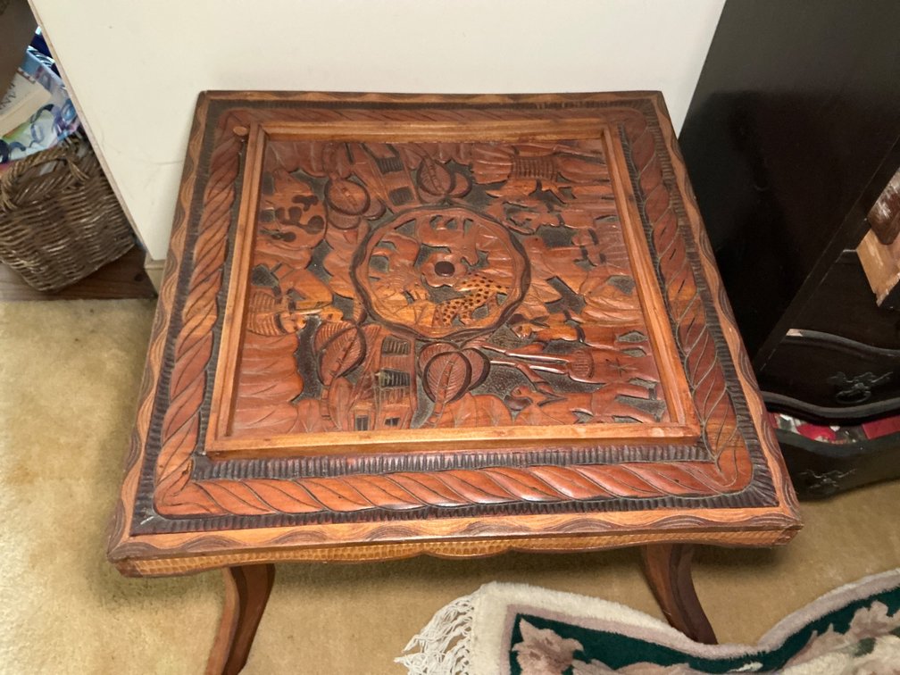 Wooden Table with Intricately Carved Figurative Top, 26x26x19 Inches