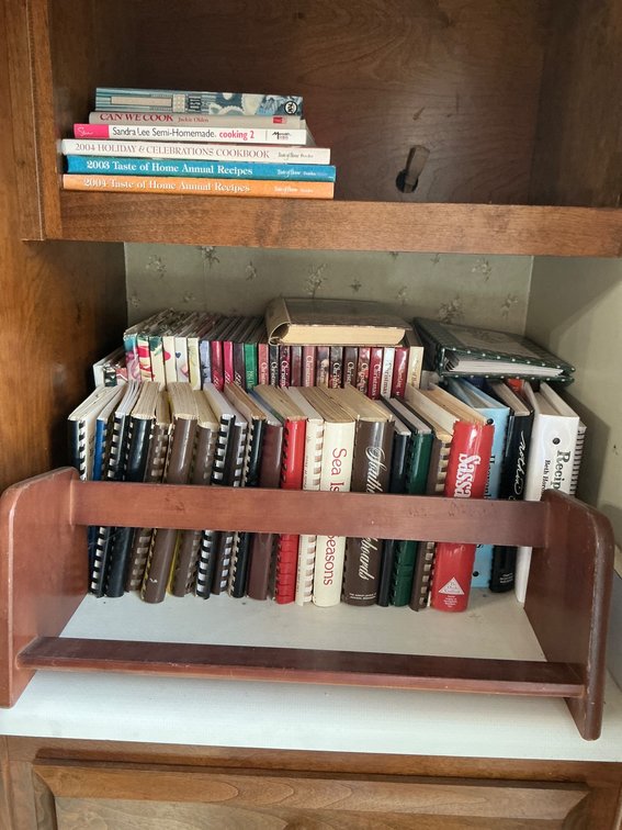 Collection of Cookbooks and Recipe Compilations with Wooden Shelf