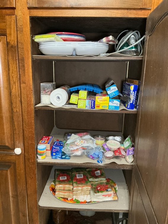 Kitchen Pantry With Various Storage Items and Shelving