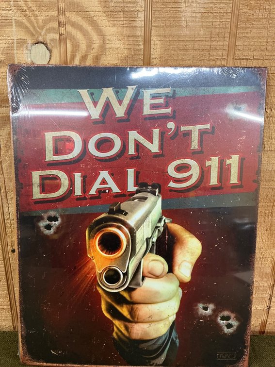 16×12.5 Metal Reproduction Sign: ‘We Don’t Dial 911’