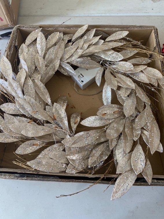 Three Decorative Wreaths Featuring Various Themes