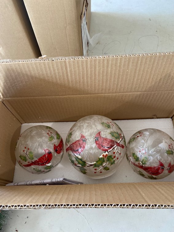 Holiday-Themed Decorations Including Cardinal Glass Orbs and Snowman Wreath