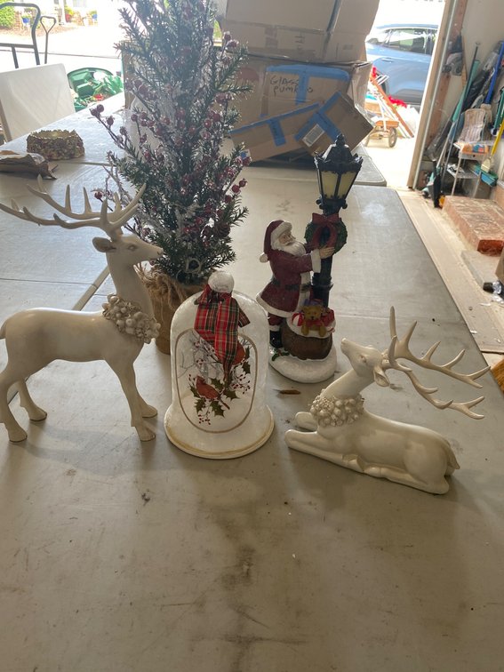 Decorative Holiday Figurines Featuring Reindeer, Santa, and Tree