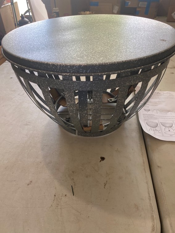 Metal Fire Pit Featuring Circular Cutout Design With Instructions