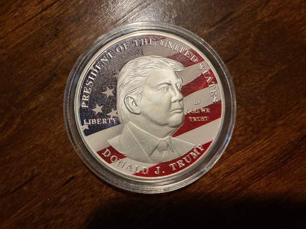 Donald J. Trump Commemorative Coin Featuring American Flag Design