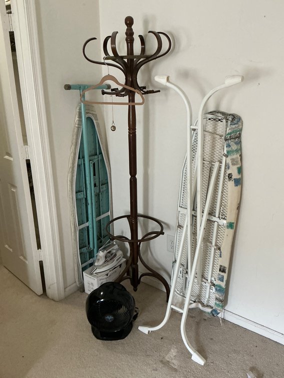 Two Irons, Ironing Boards, Coat Hanger, and Fan