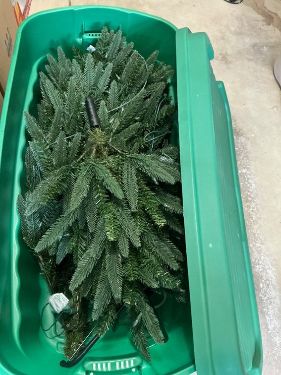 Artificial Lighted Tree in Rubbermaid Storage Container