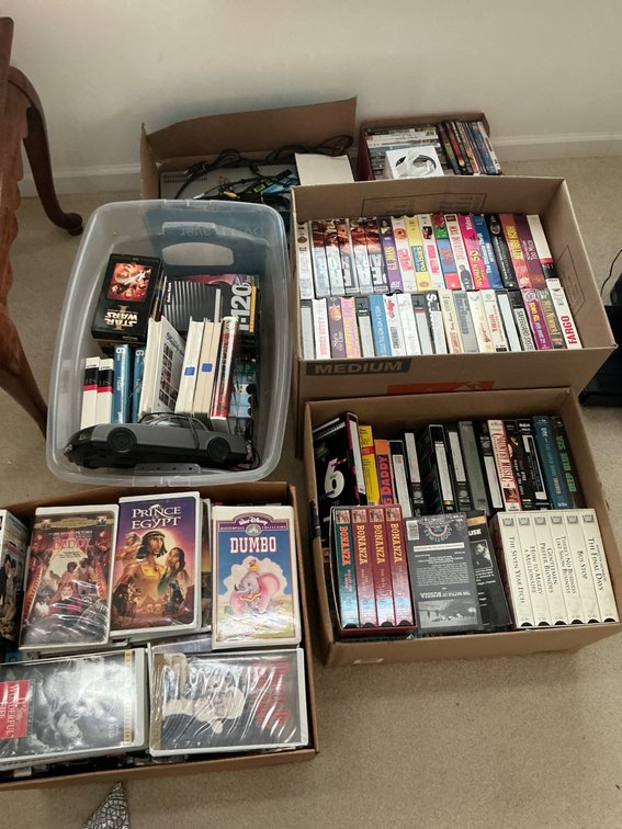 Comprehensive Collection of VHS Tapes, DVDs, and Accessories