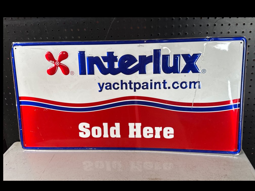 Interlux Embossed Metal Advertising Sign