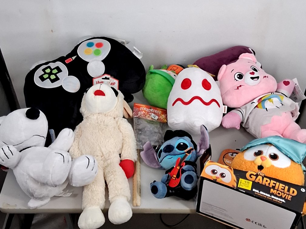 lot of stuffies incl. gaming controller pillow