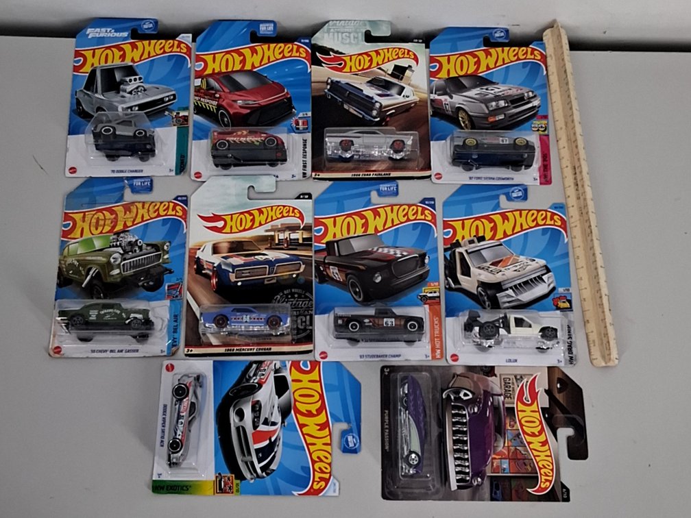 10 Hotwheels toy cars in packaging