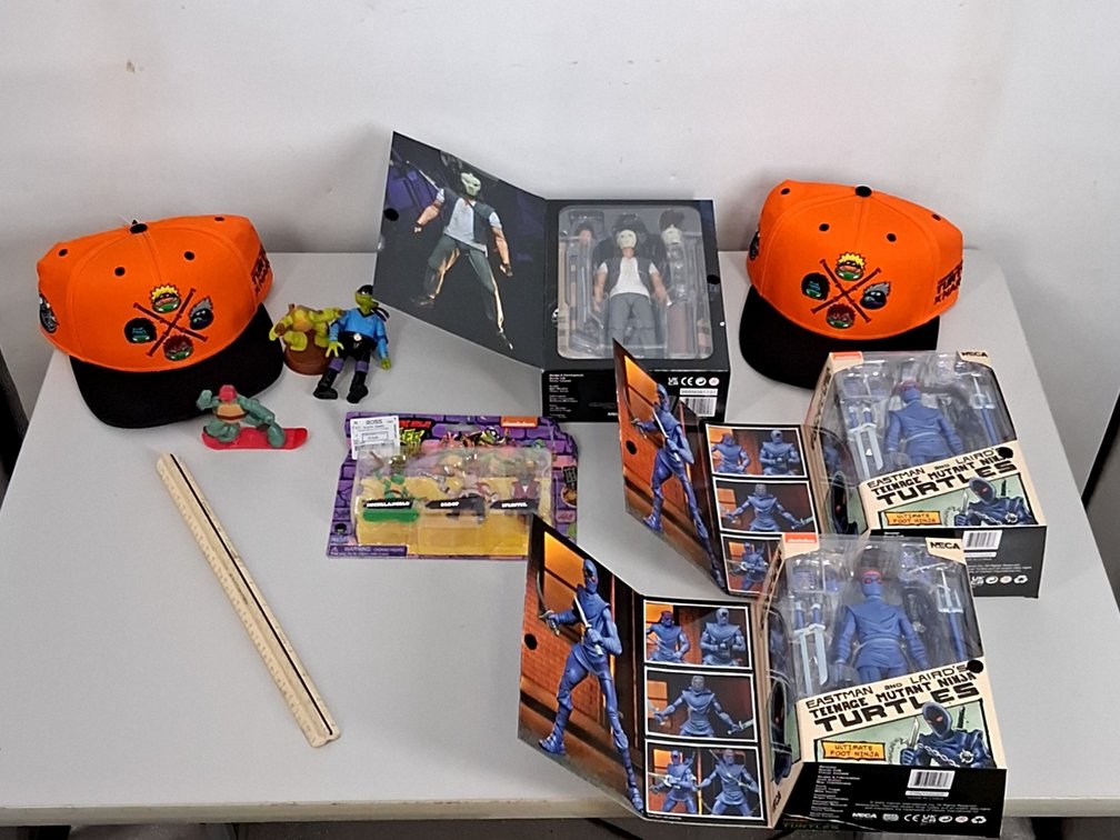 lot of TMNT action figures and hats incl.