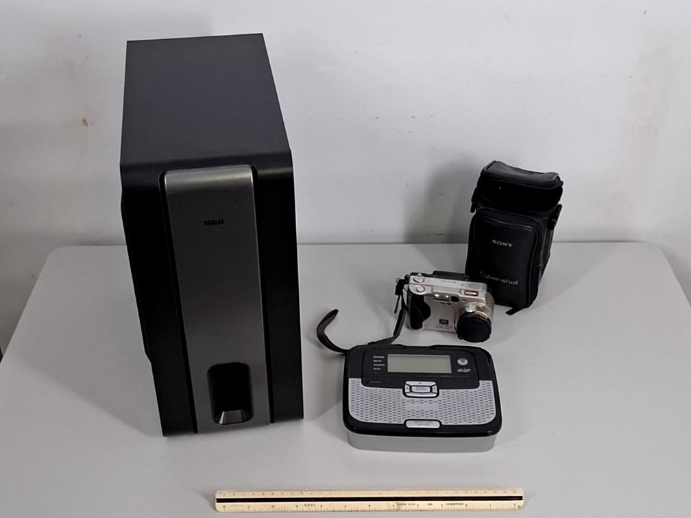 Sony Cybershot camera, RCA subwoofer and